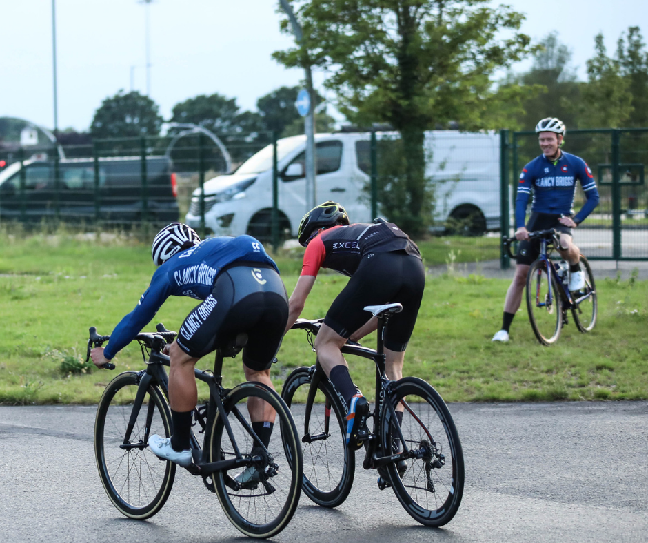 A close sprint finish in a closed circuit road cycle race.